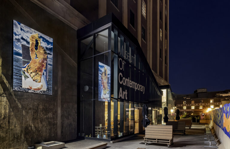 The lightbox showing Aaron Jones's "Conscious Energy on the Sea" on the west external wall of the building at night