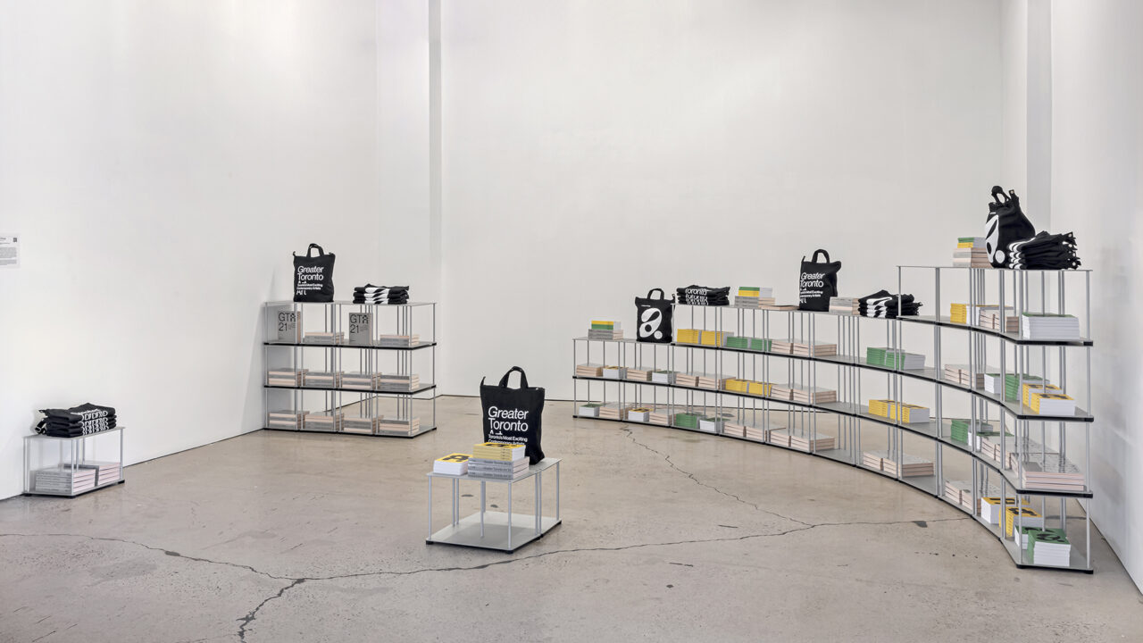 GTA21 SHop with Tom Chung's "50 Shelves (study for MOCA)" (2021) with GTA21 tote bags, notebooks, and publications