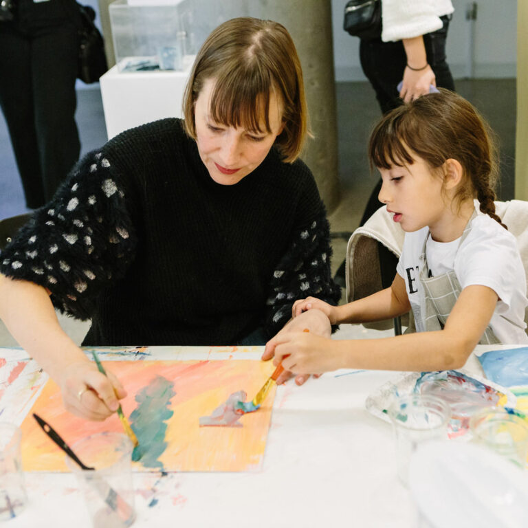 Participants in a family friendly art workshop