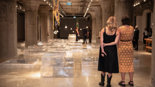Photo of visitors enjoying Liz Magor's "The Separation"